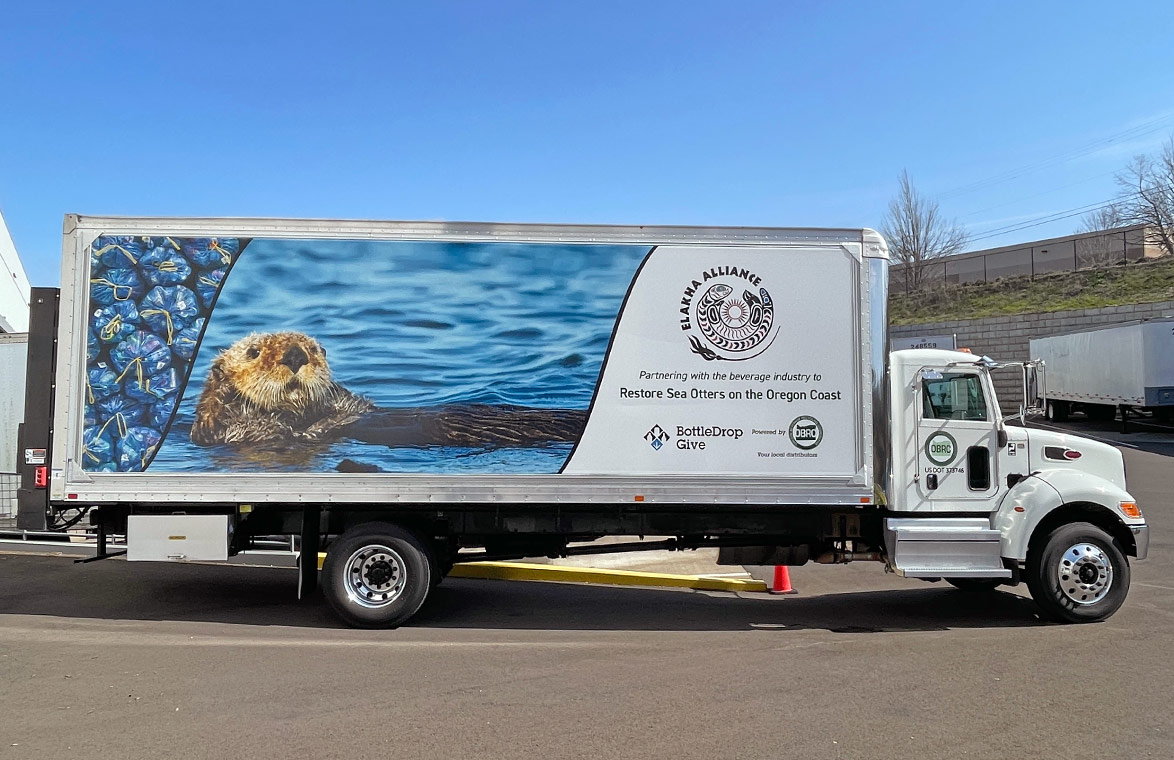 An OBRC truck emblazoned with a partnership message with the Elakha Alliance to restore Sea Otters on the Oregon Coast.